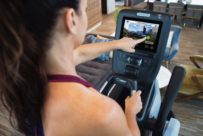 Close-up of a Precor P82 console on a Precor AMT 885 Adaptive Motion Trainer in a home gym