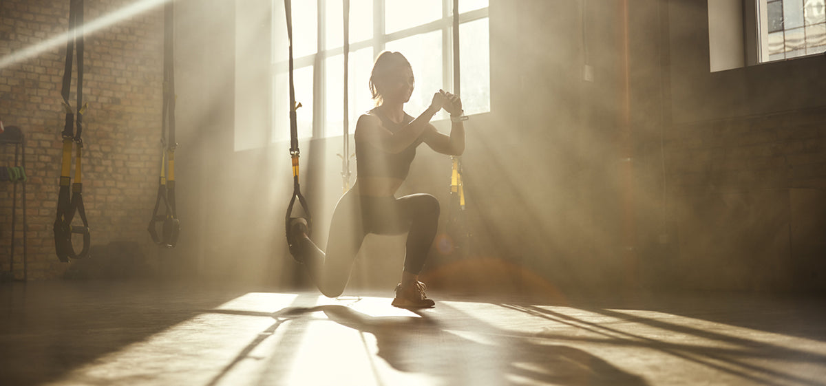 Person doing lunges with functional training tools