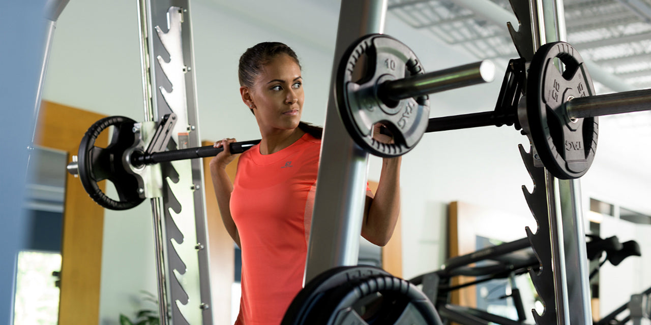 Female strength training in home gym