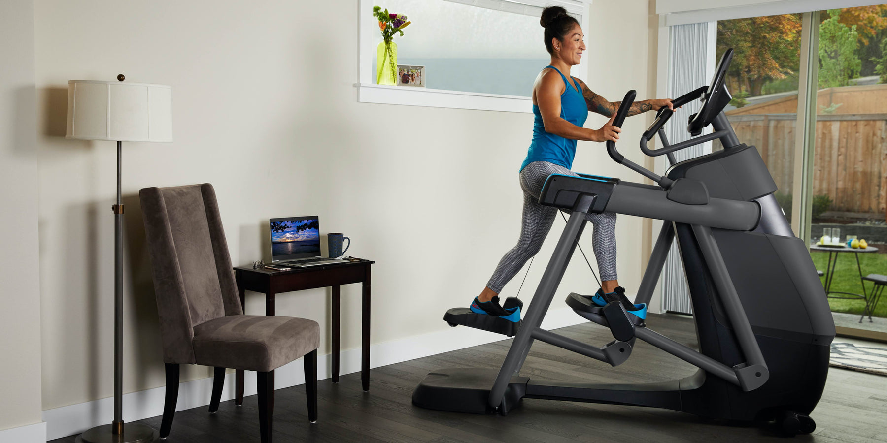 female exerciser cardio workout at home with the Precor 800 line AMT adaptive motion trainer