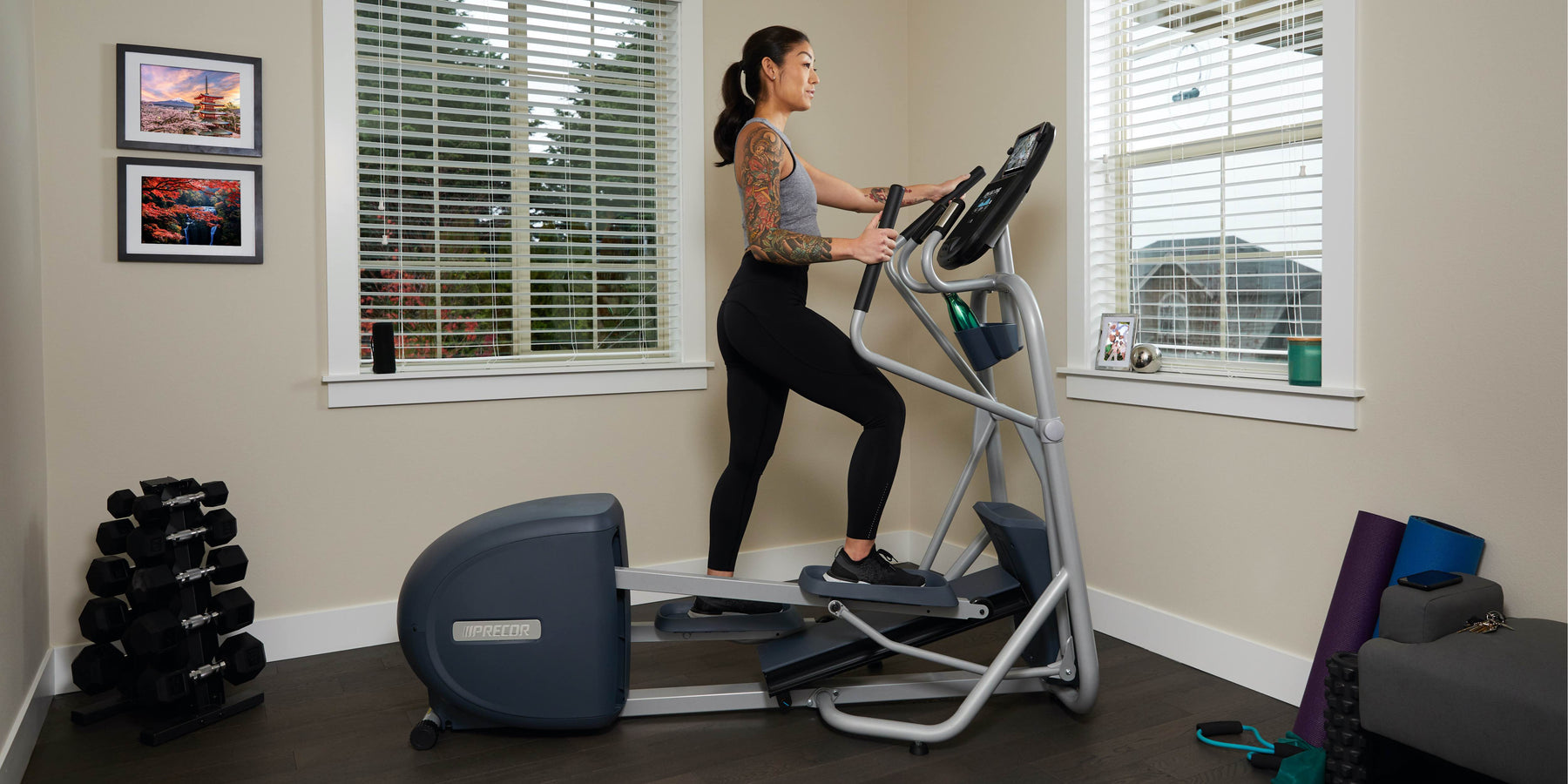 female exerciser cardio workout with Precor EFX 200 line elliptical at home